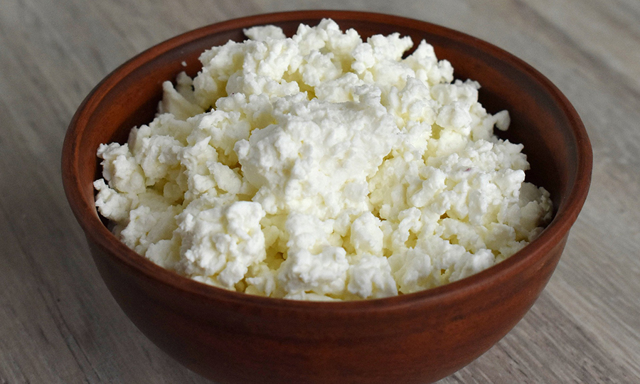 A bowl of cottage cheese on a table