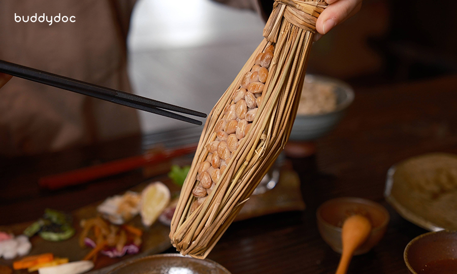 natto nestled between a straw spoon